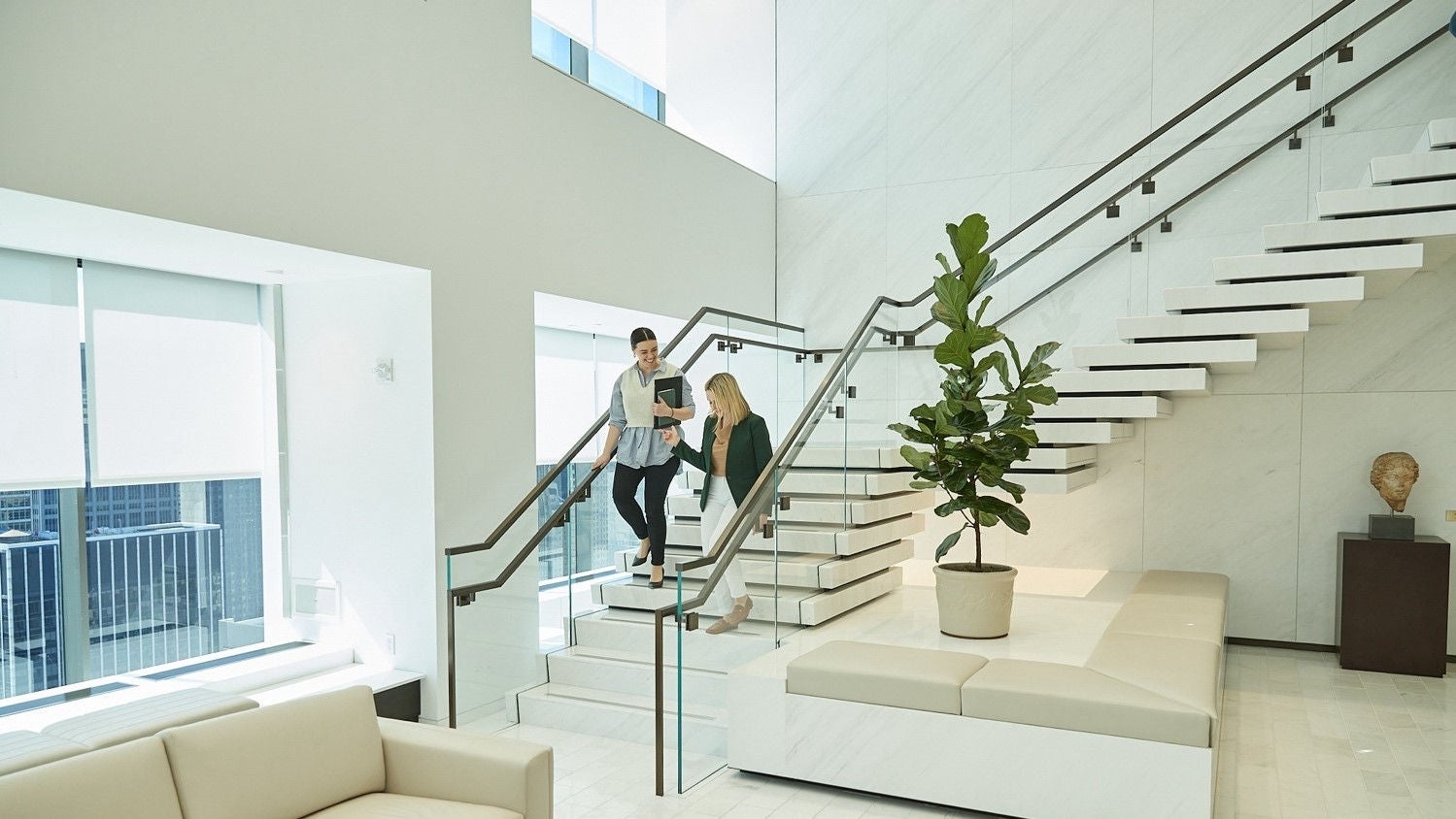 Employees walking down stairs together