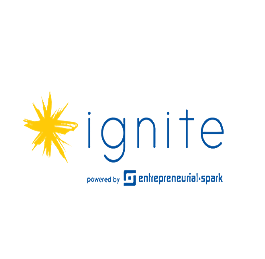 Ignite Bermuda logo featuring a yellow burst graphic beside the word “ignite” in blue lowercase letters, with a tagline “powered by Entrepreneurial Spark.
