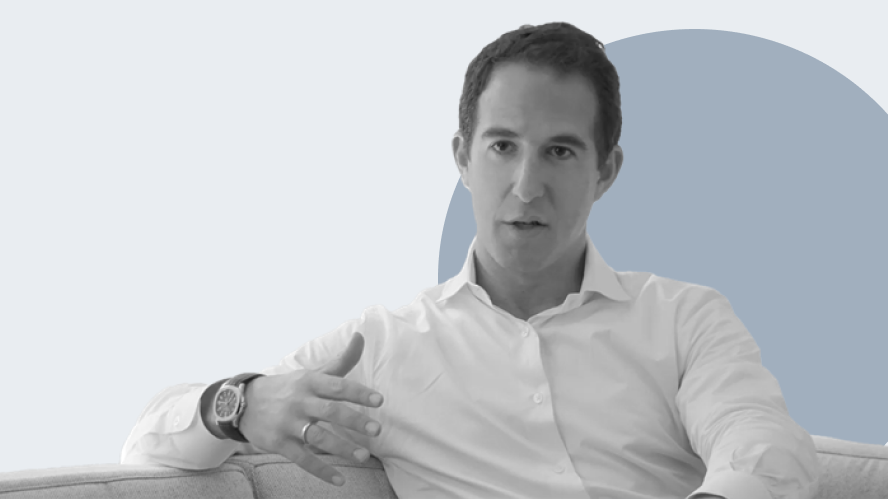 Black-and-white portrait of Apollo Partner Sambur seated in conversation, gesturing while discussing software sector challenges and private equity trends in asset management and private markets.