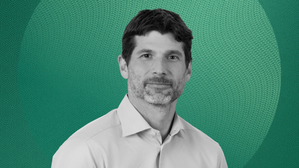 Black-and-white headshot of Rob Bittencourt, Partner and Head of Thematic Investing at Apollo, wearing a light-colored collared shirt against a green gradient background with a circular graphic.
