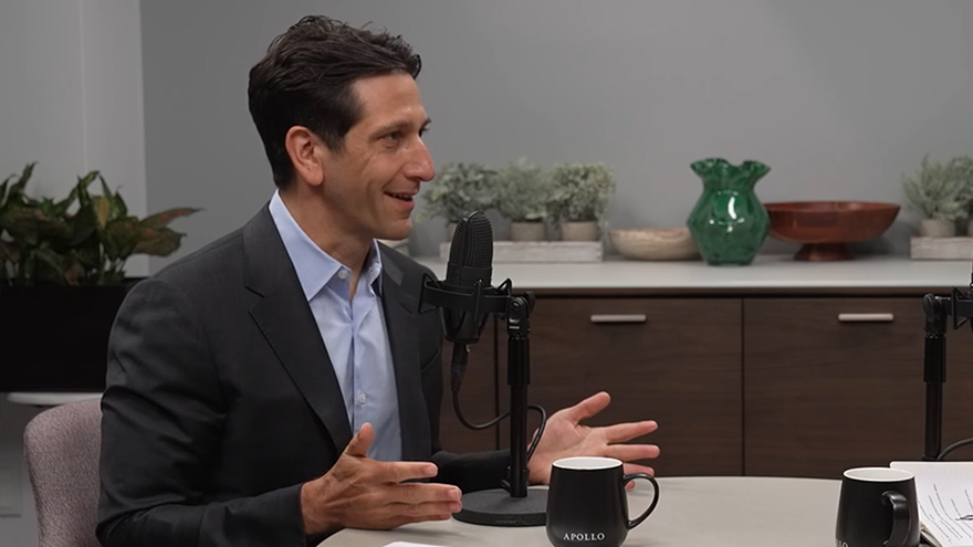 Apollo Head of Hybrid Matt Nord speaks into a microphone during a podcast episode about hybrid investing and its risk/reward framework
