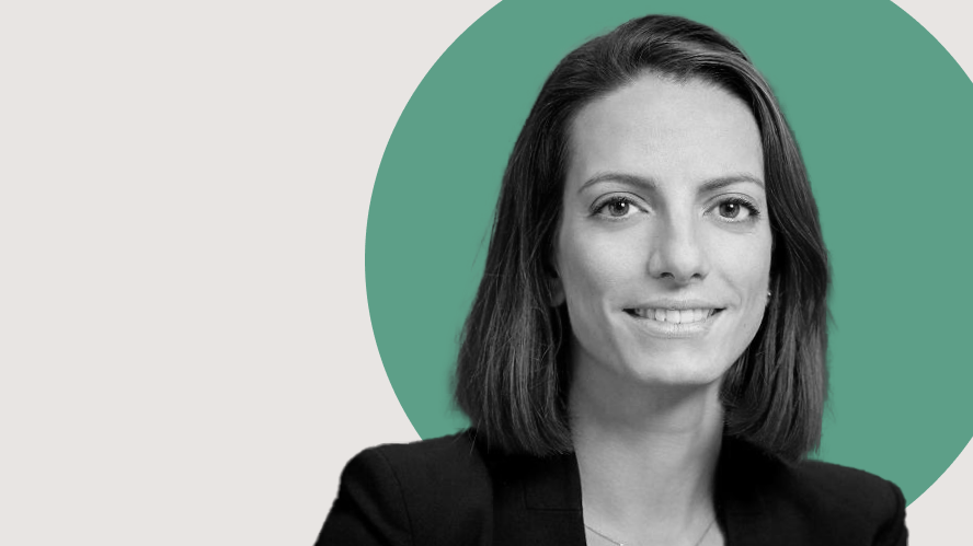 Professional headshot of a woman in a black blazer, smiling in front of a minimalist green circle backdrop, used for executive team marketing content on Apollo’s private credit and capital solutions pages.