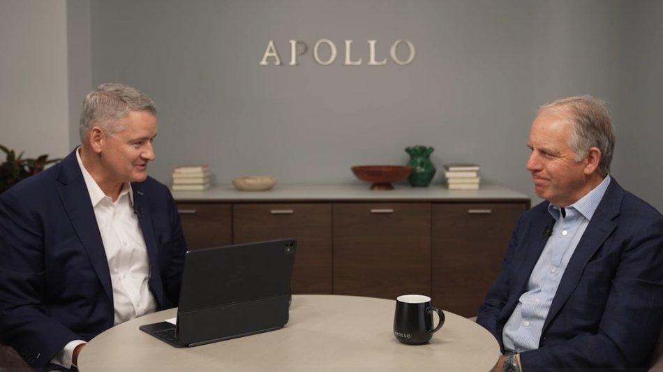 Marc Rowan, Apollo CEO, is seated on stage in a dark suit and white shirt, speaking into a headset mic at the 2025 Bloomberg New Economy Forum in Singapore, with a teal background displaying the event’s logo.